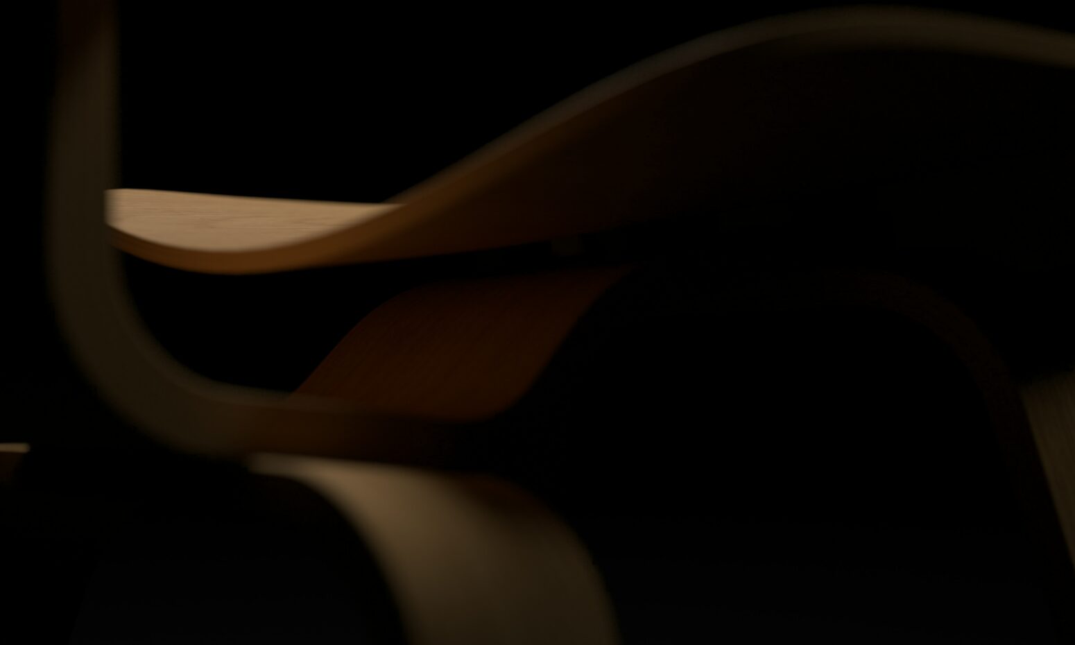 Close-up of a brown wooden chair with black background