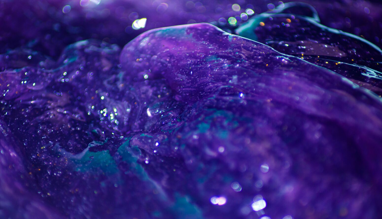 An undulating mass of purple, sparkly goo.