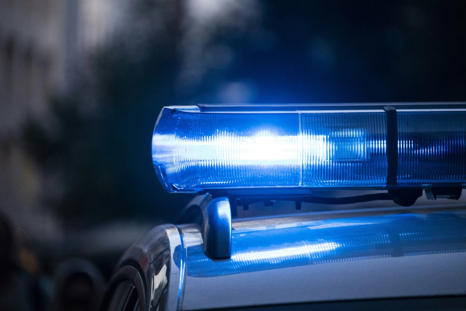 Blue side of a police light, lit up.
