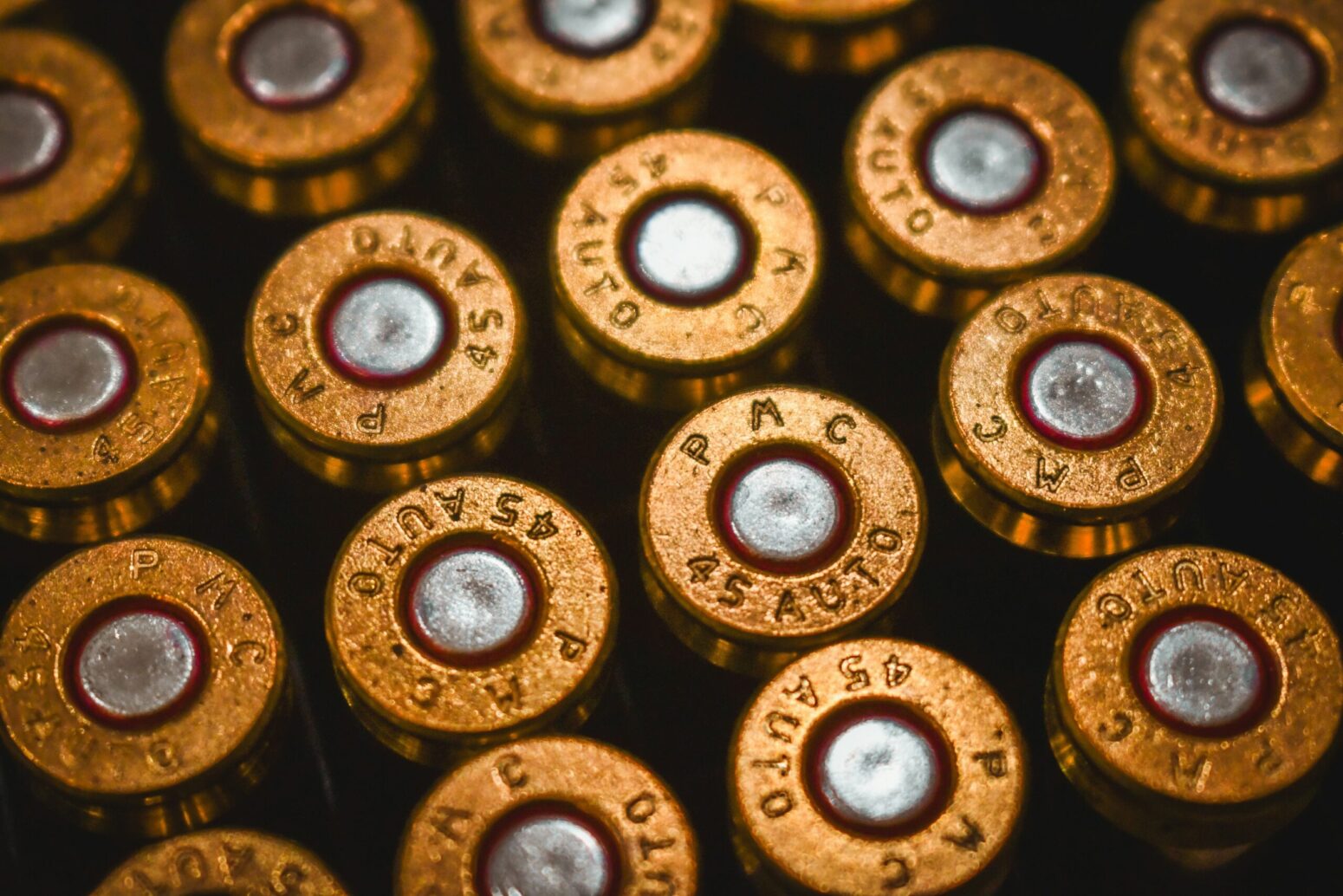 A close up image of some 45 caliber ammunition
