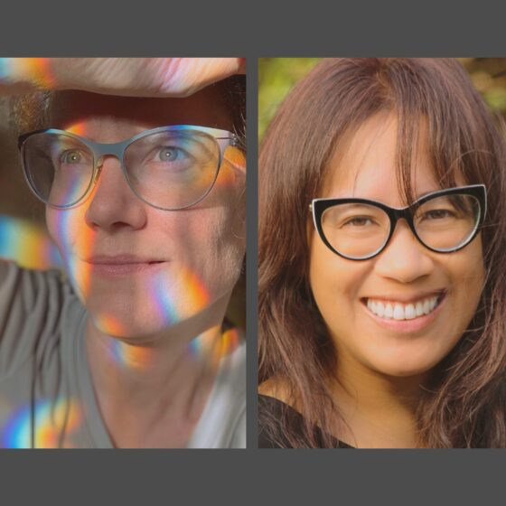 DULSE, a duo comprising of the artist and writer Lee Deigaard and the novelist Mandy-Suzanne Wong. On the left, Deigaard looks off camera while surrounded by prism rainbow. On the right, Wong looks at the camera, smiling broadly. Deigaard wears glasses with silver frames, and Wong wears glasses with black frames.