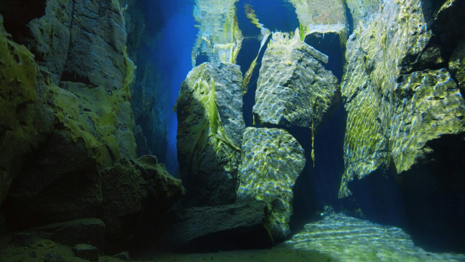 Weathered stone ruins underwater.