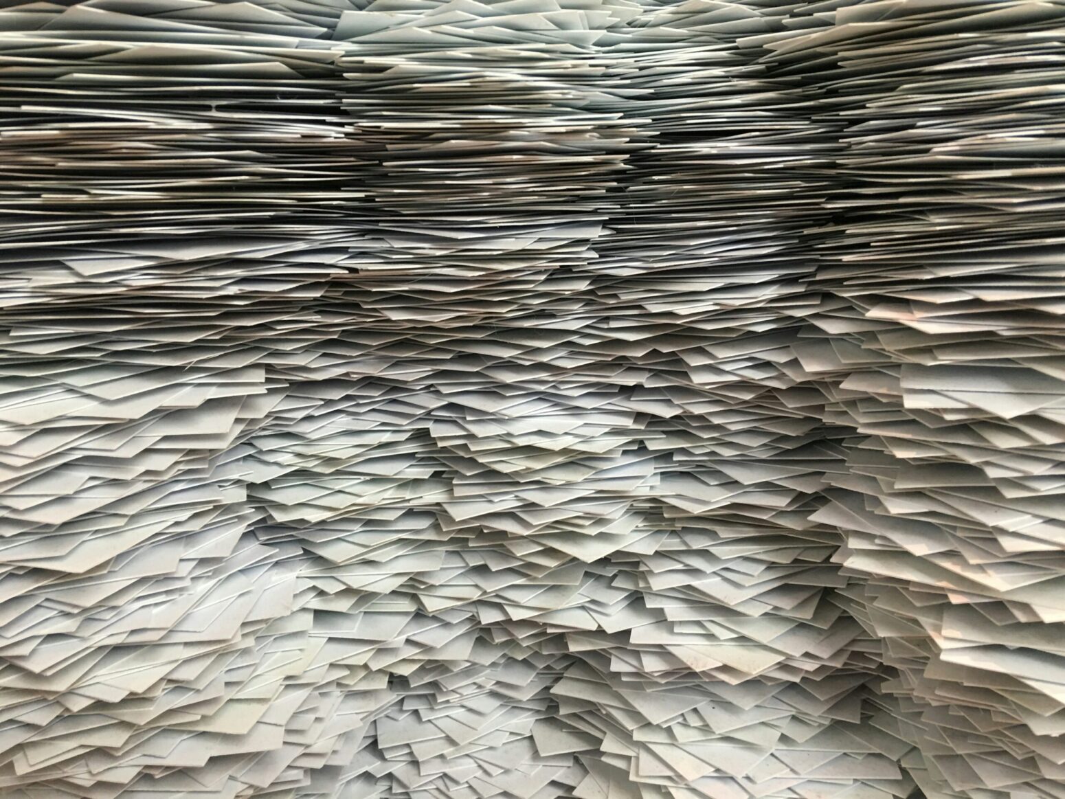 Stacks and stacks of many pieces of white paper.