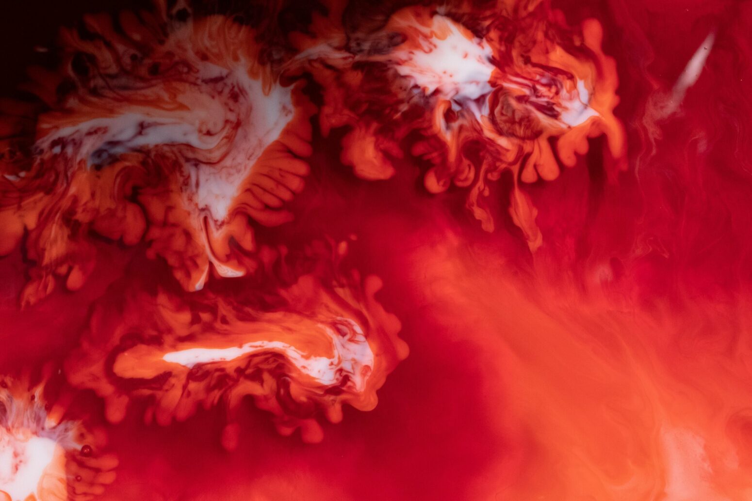 Red blood being poured into milk.