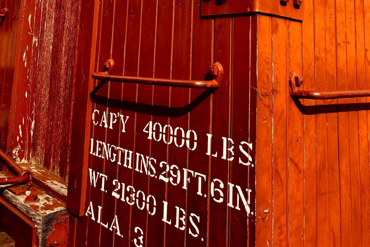 The side of a red freight car.