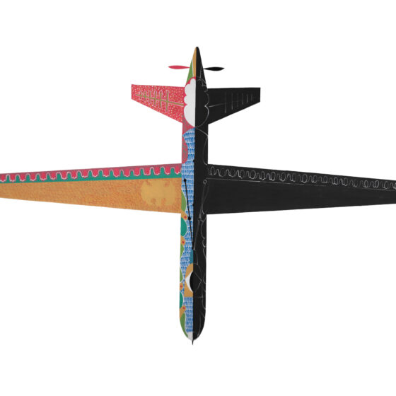 The shape of a large plane on a white sheet of paper. Half of the plane is made of colorful patterns of yellow, blue, red, and green, while the other half is completely black.