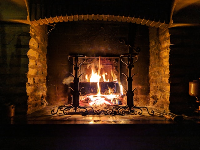 A lit brick fireplace