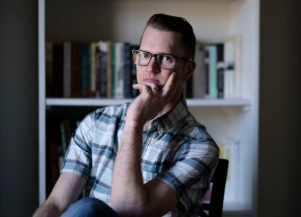 Christopher uses he/him pronouns.