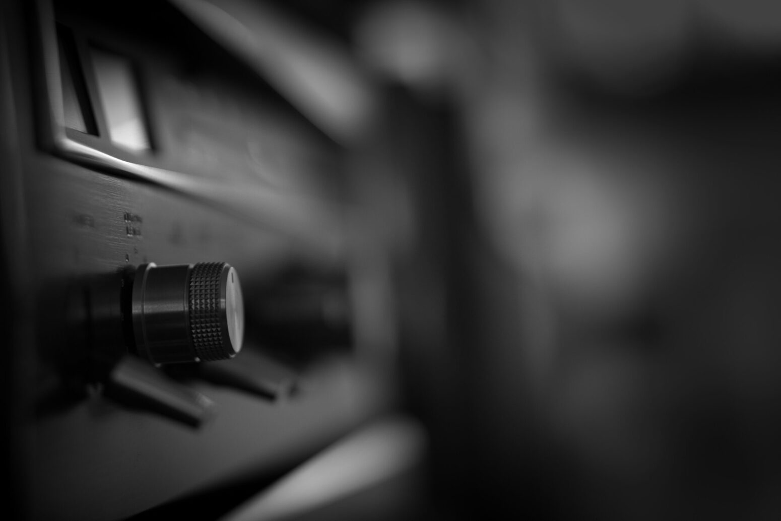 This black and white photograph shows a radio, presumably on mute.