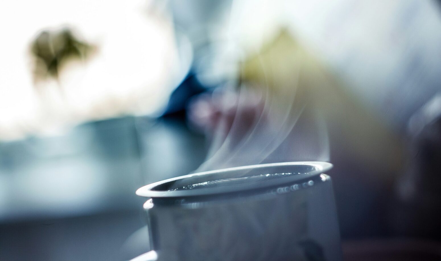 This photograph shows vapor coming out of a candle, with an intentional blurred background.