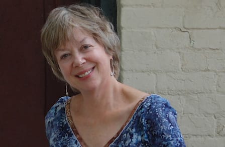 A smiling woman with short graying hair