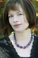 A woman with bob cut and bangs