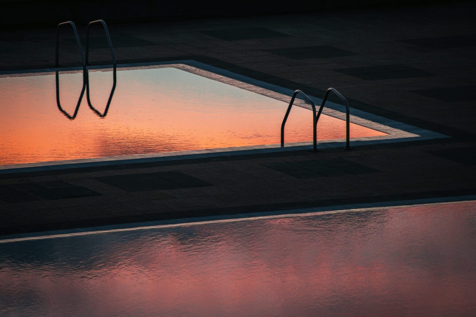 Swimming pool reflecting sunset