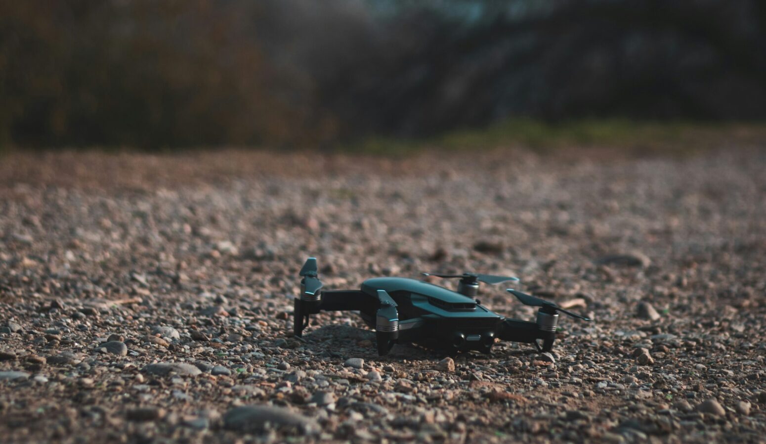 A black drone on the ground