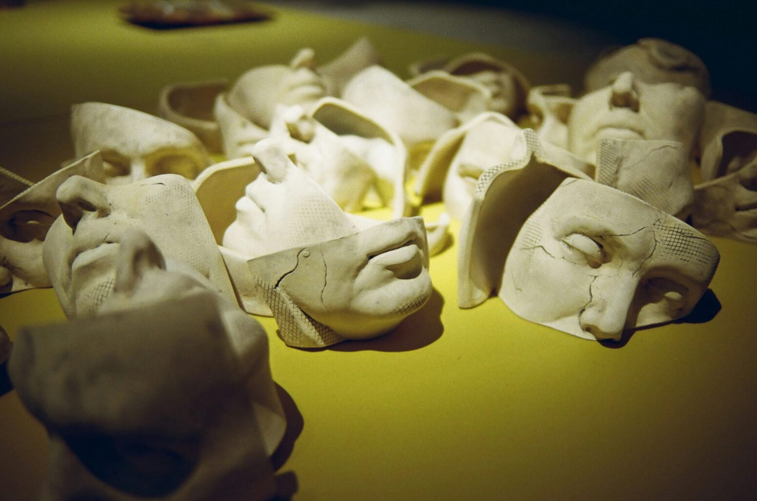 A bunch of white masks, half broken