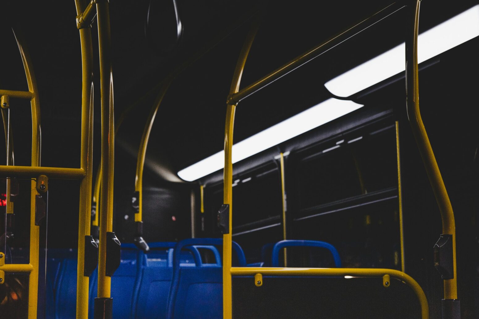 A dimly lit inside of a bus